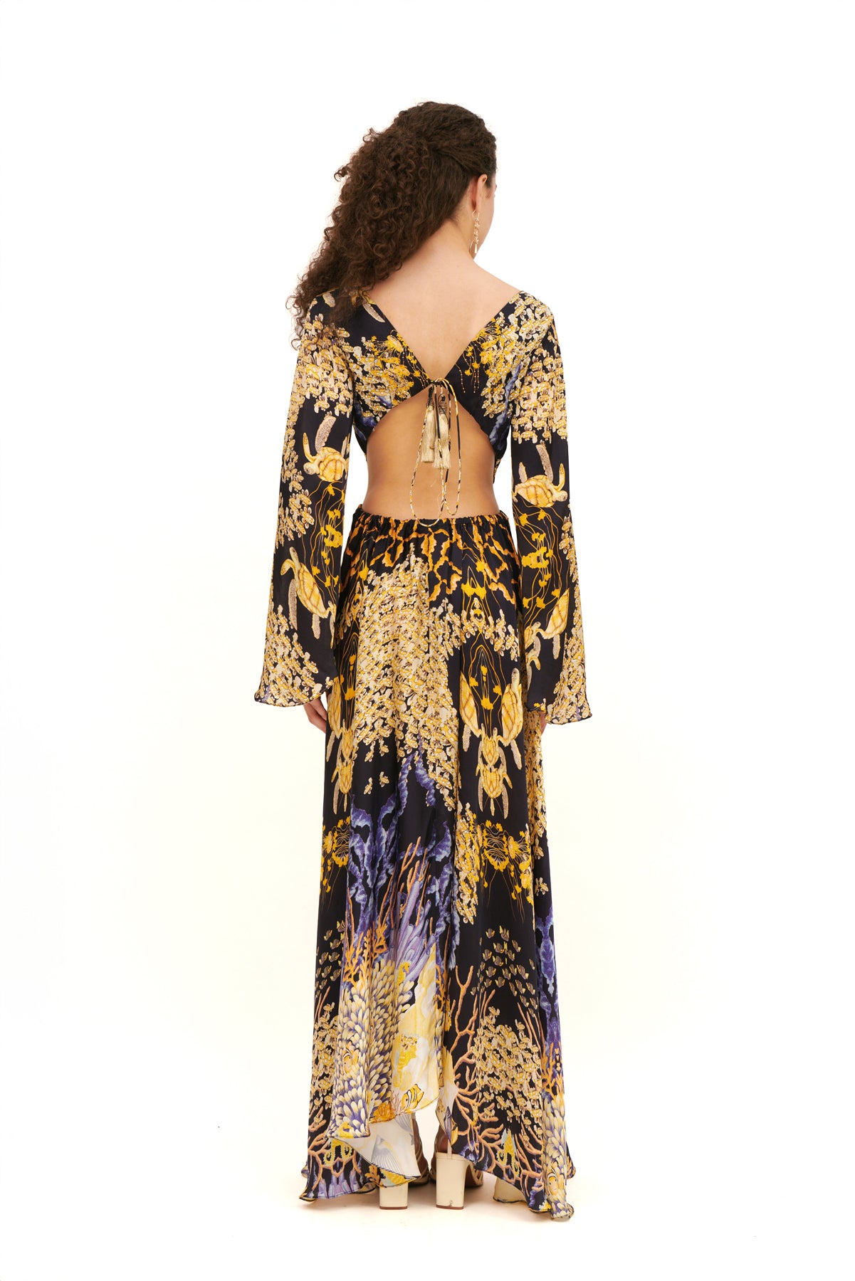 Cut-out long sleeves dress with a modern design and flattering fit for a bold, chic look.