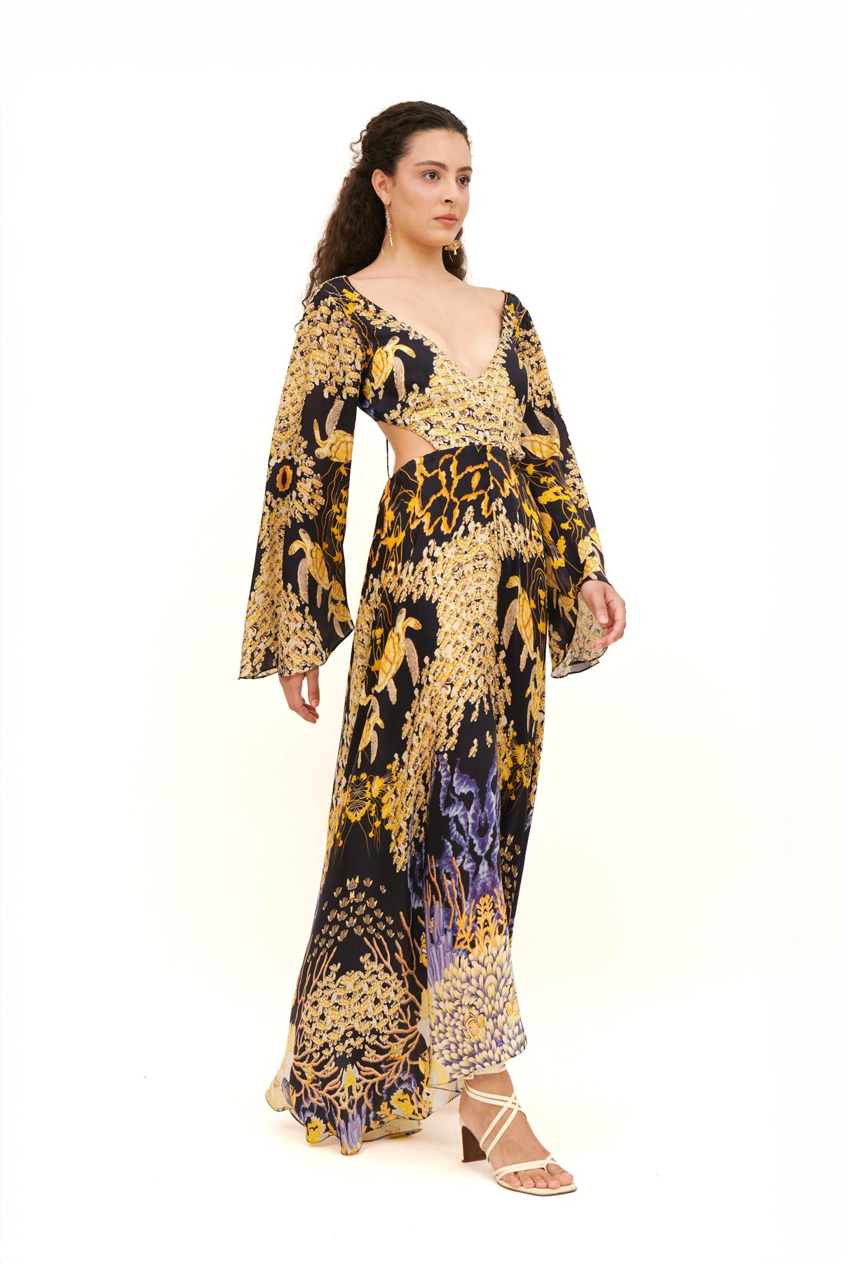 Cut-out long sleeves dress with a modern design and flattering fit for a bold, chic look.