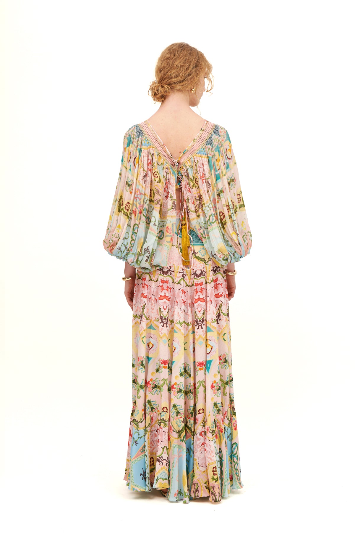 Gathered long sleeves top with a flattering fit and elegant design for a chic, feminine look.