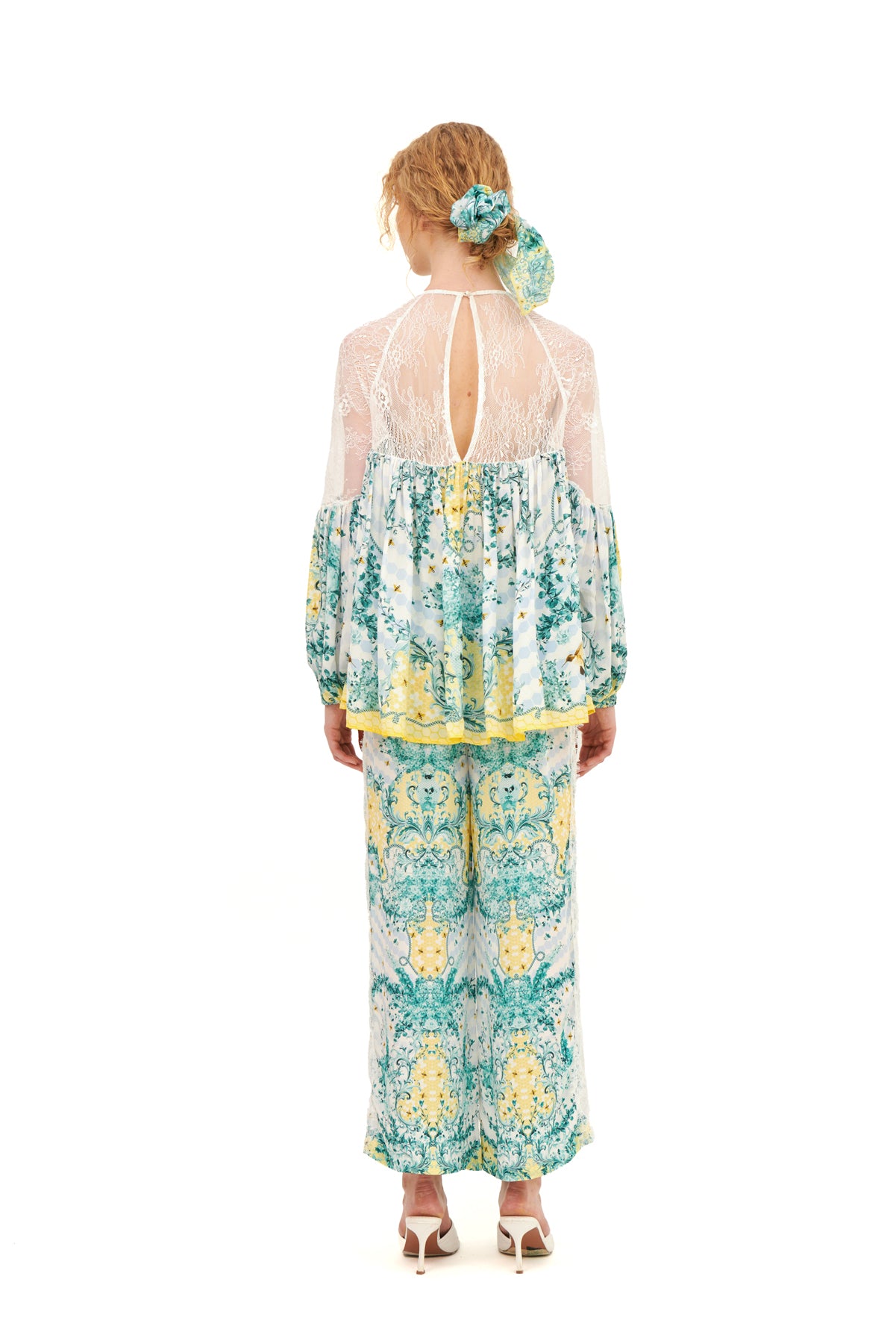 Long lounge pants with lace inserts, offering a relaxed fit and a touch of elegance for a comfortable, stylish look.