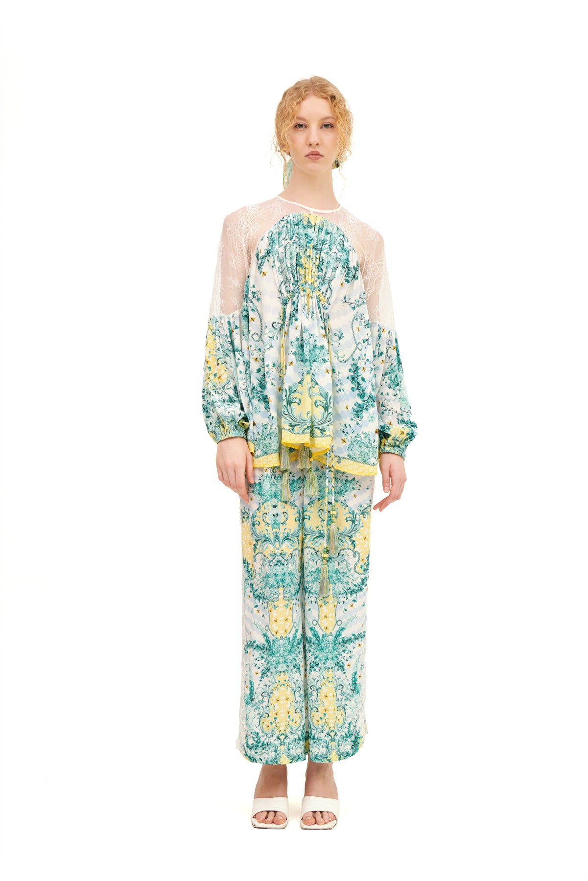 Long lounge pants with lace inserts, offering a relaxed fit and a touch of elegance for a comfortable, stylish look.