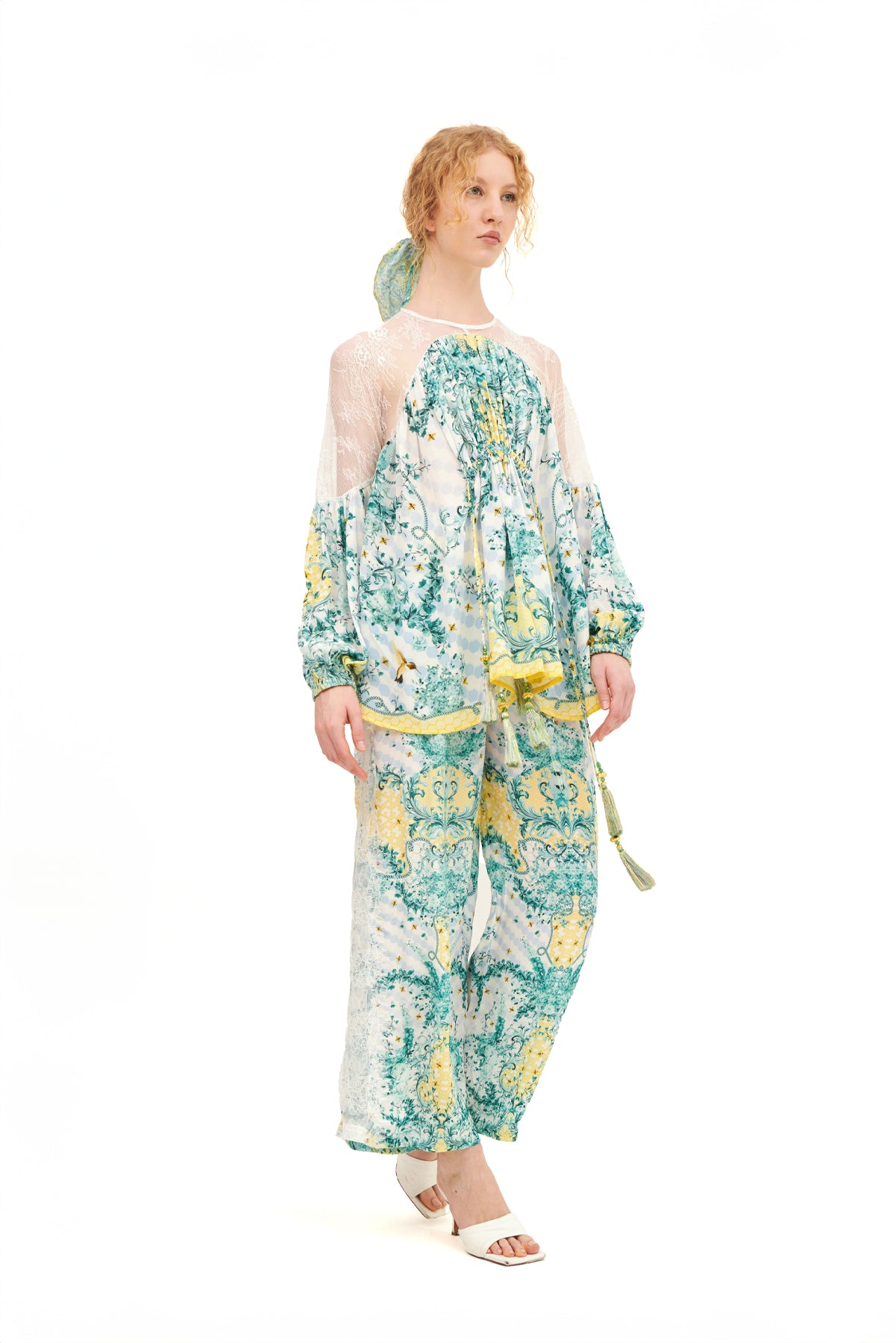 Long lounge pants with lace inserts, offering a relaxed fit and a touch of elegance for a comfortable, stylish look.