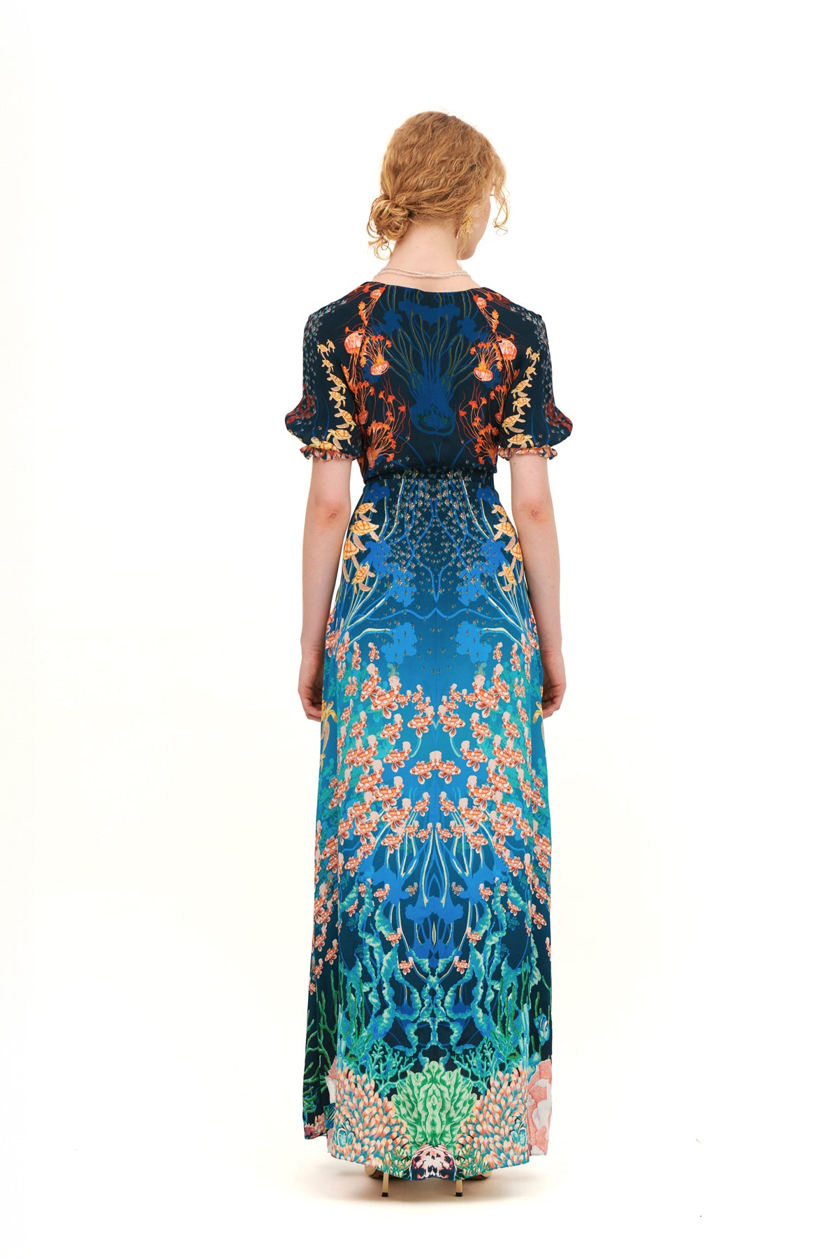 Long dress with draped bow detail on the bodice.