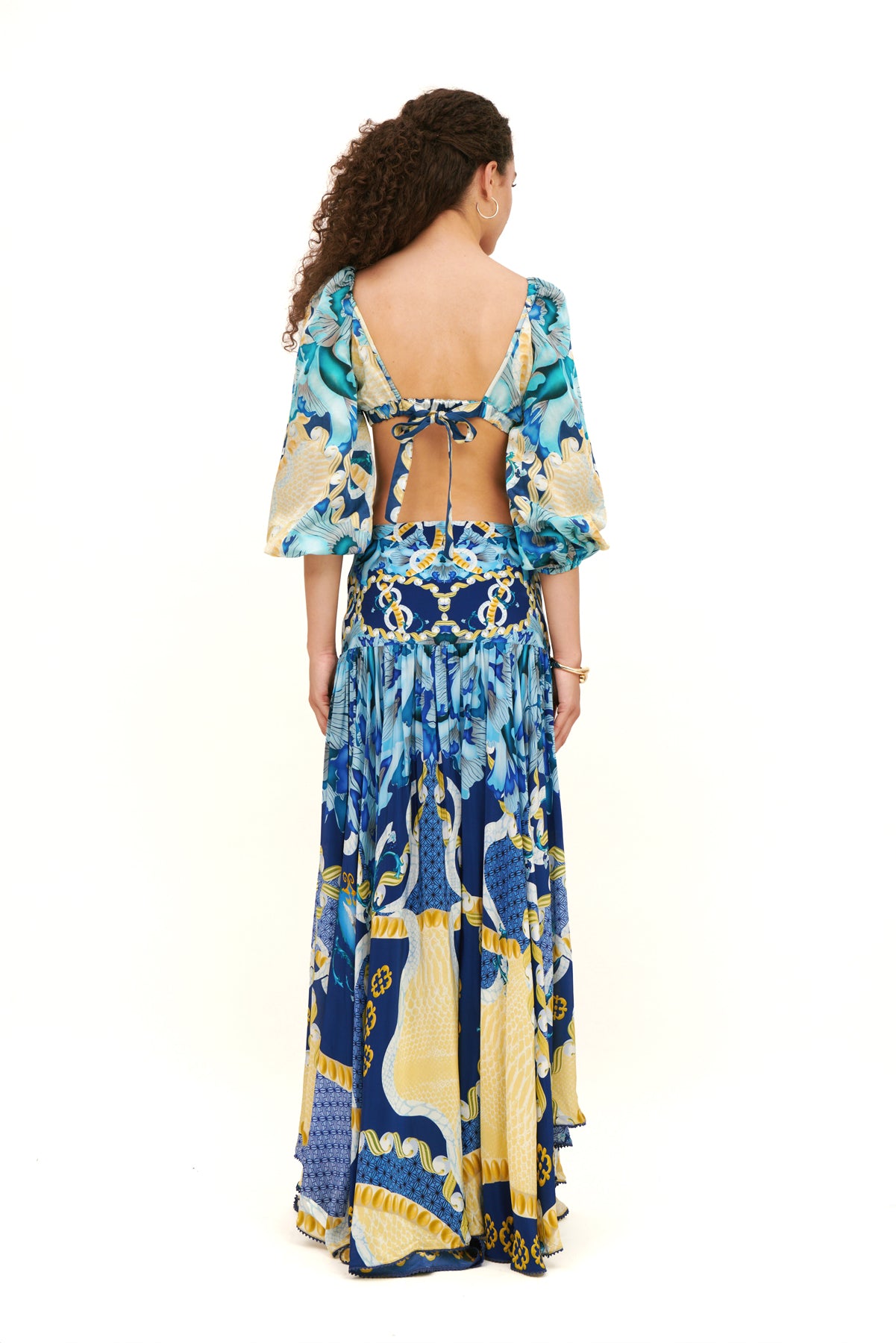 Bra top with puffy sleeves, offering a feminine silhouette and playful design for a chic, stylish look.