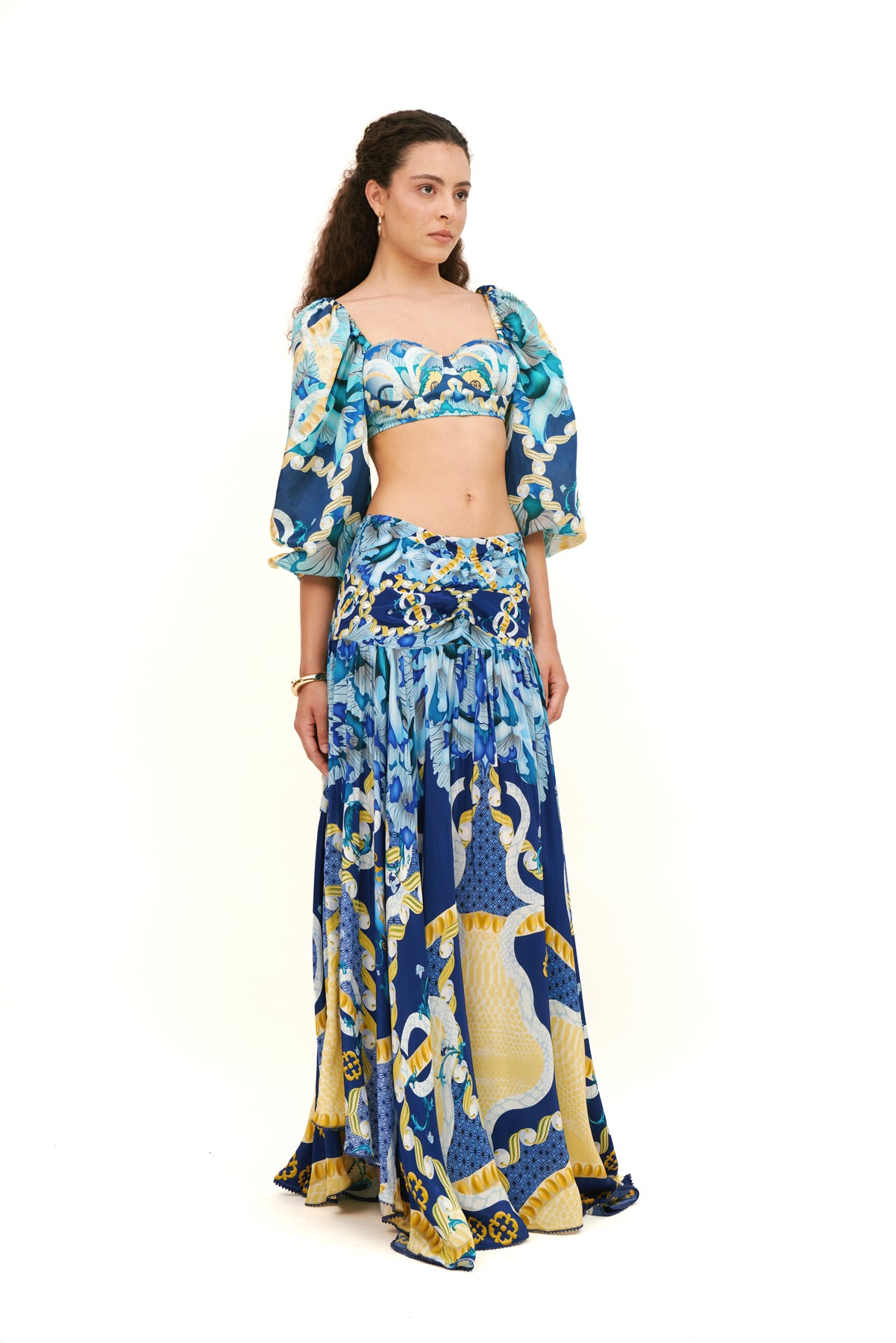 Bra top with puffy sleeves, offering a feminine silhouette and playful design for a chic, stylish look.