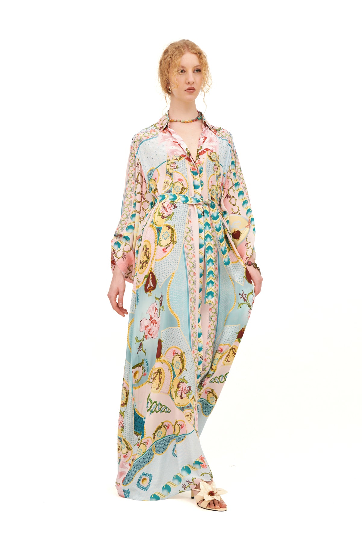 Long over-size chemisier with a flowing silhouette and relaxed fit, offering an effortless and stylish look.