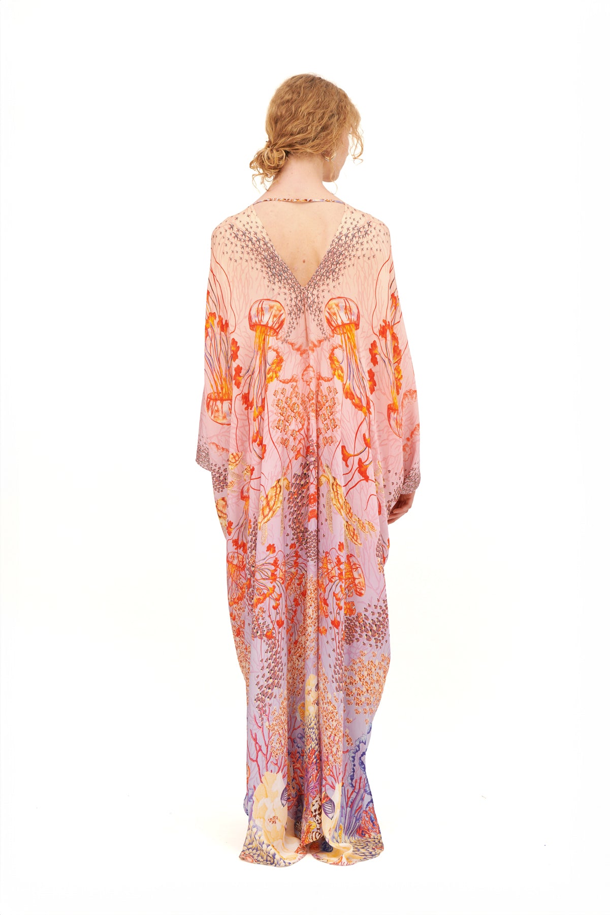 Stella gathered cover-up with a flowing silhouette and gathered details, perfect for beachside lounging or casual outings.
