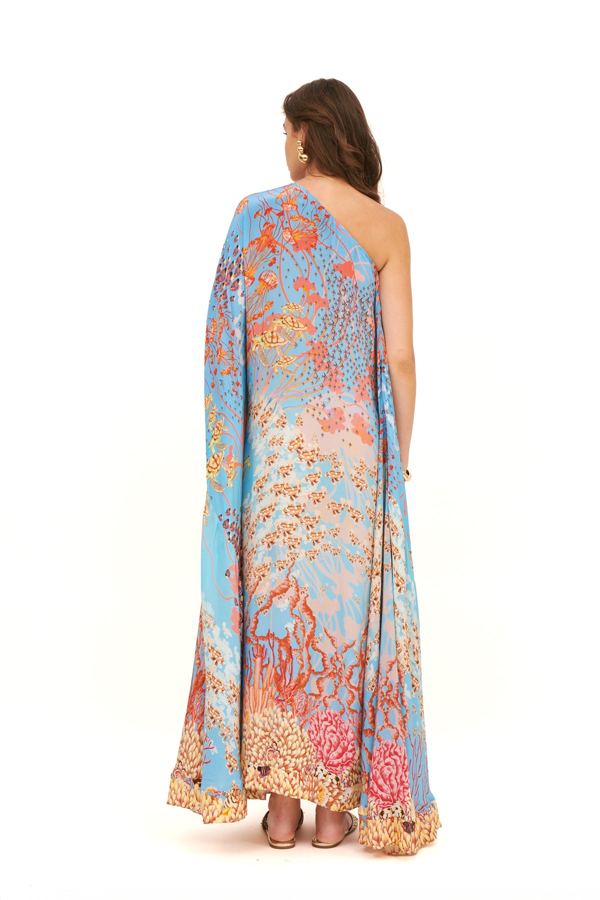 Monoshoulder cape dress with a dramatic silhouette and elegant design for a sophisticated, bold look.