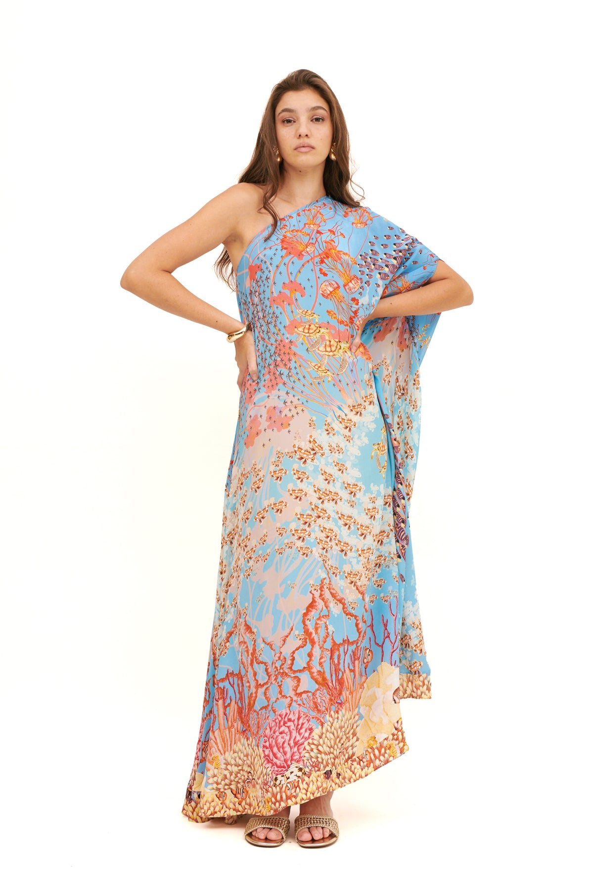 Monoshoulder cape dress with a dramatic silhouette and elegant design for a sophisticated, bold look.