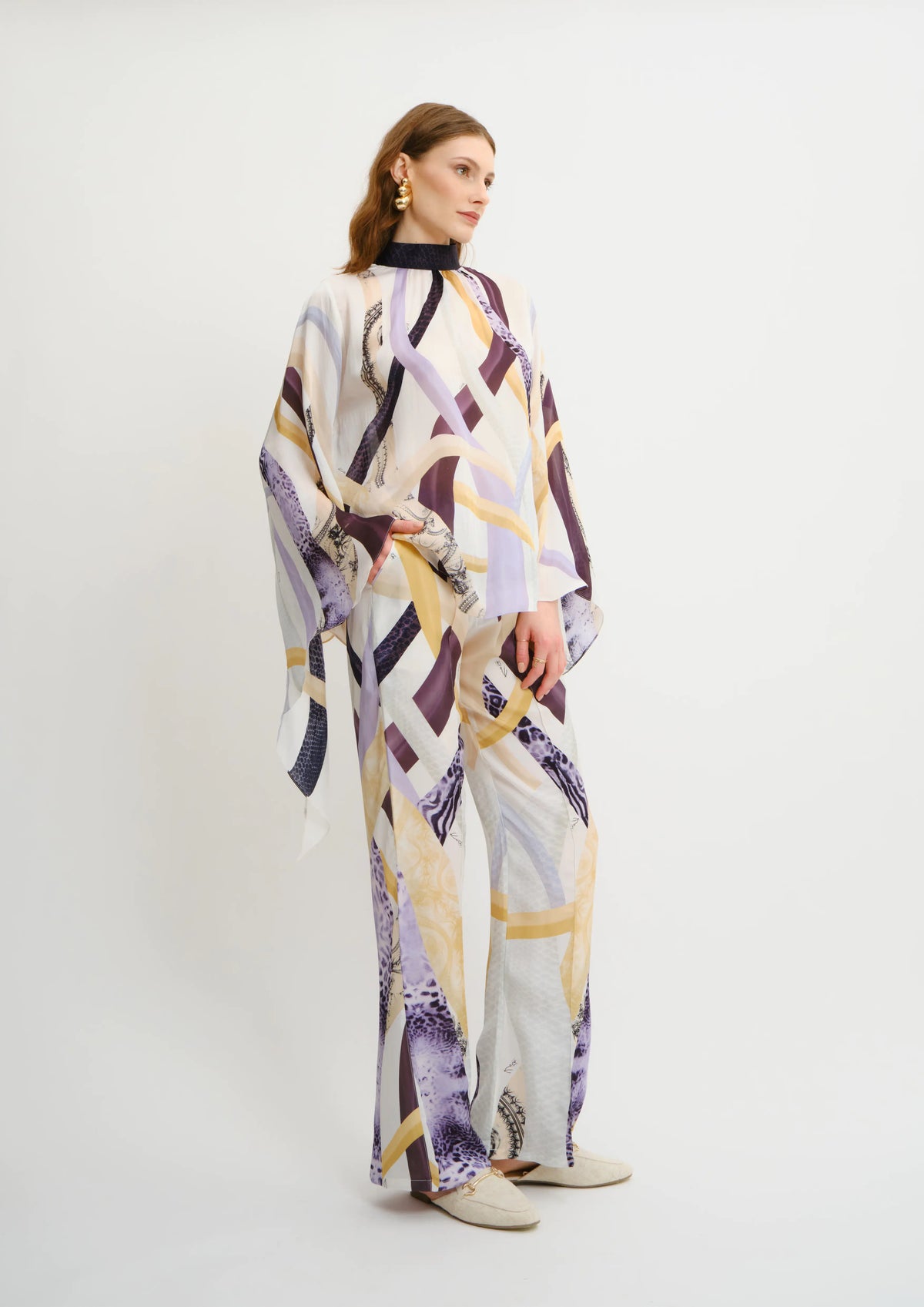 Model wearing Koré Collections Sahara Notte printed trousers styled for summer resortwear