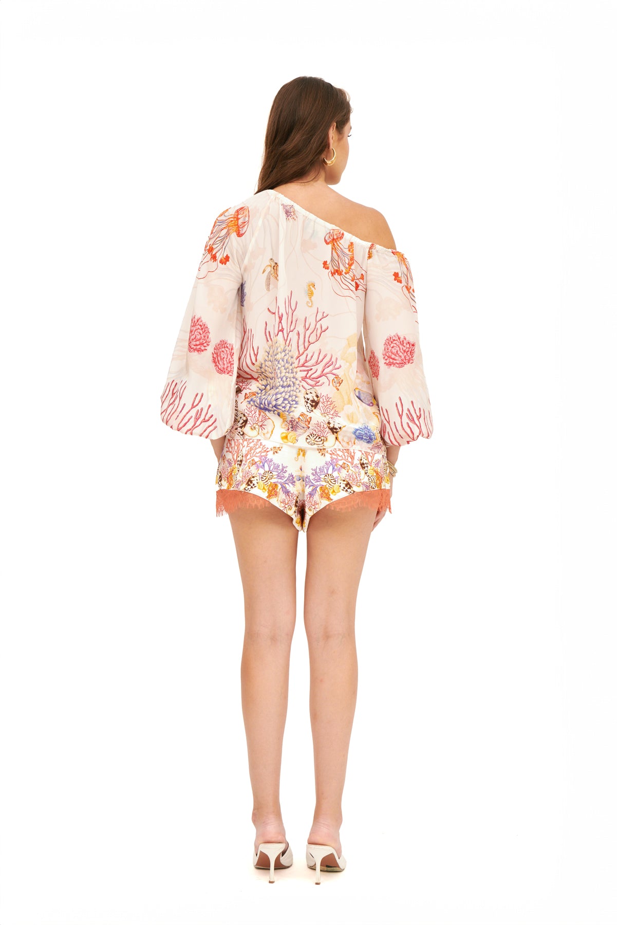 Off-shoulder top with balloon sleeves, featuring a relaxed fit and elegant design for a chic, feminine look.