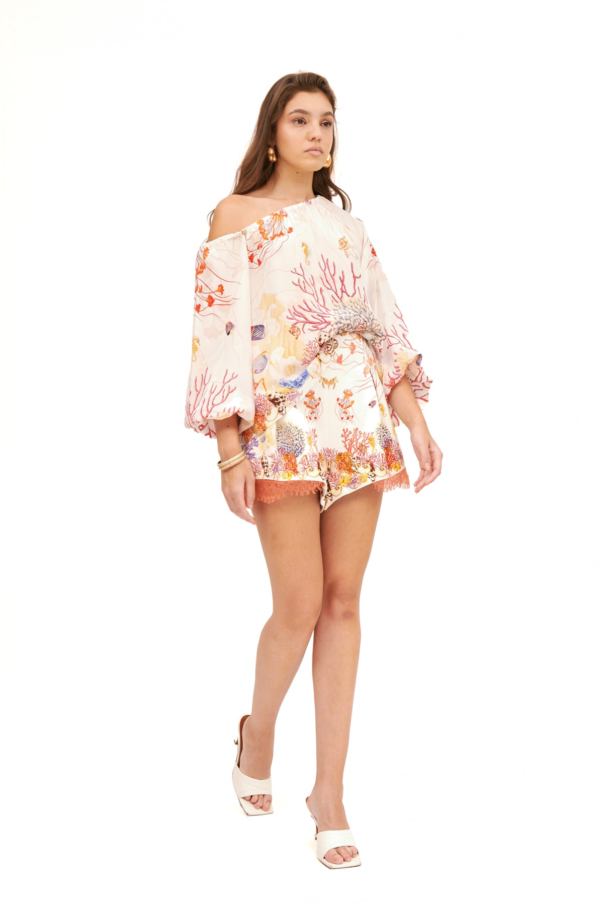 Off-shoulder top with balloon sleeves, featuring a relaxed fit and elegant design for a chic, feminine look.