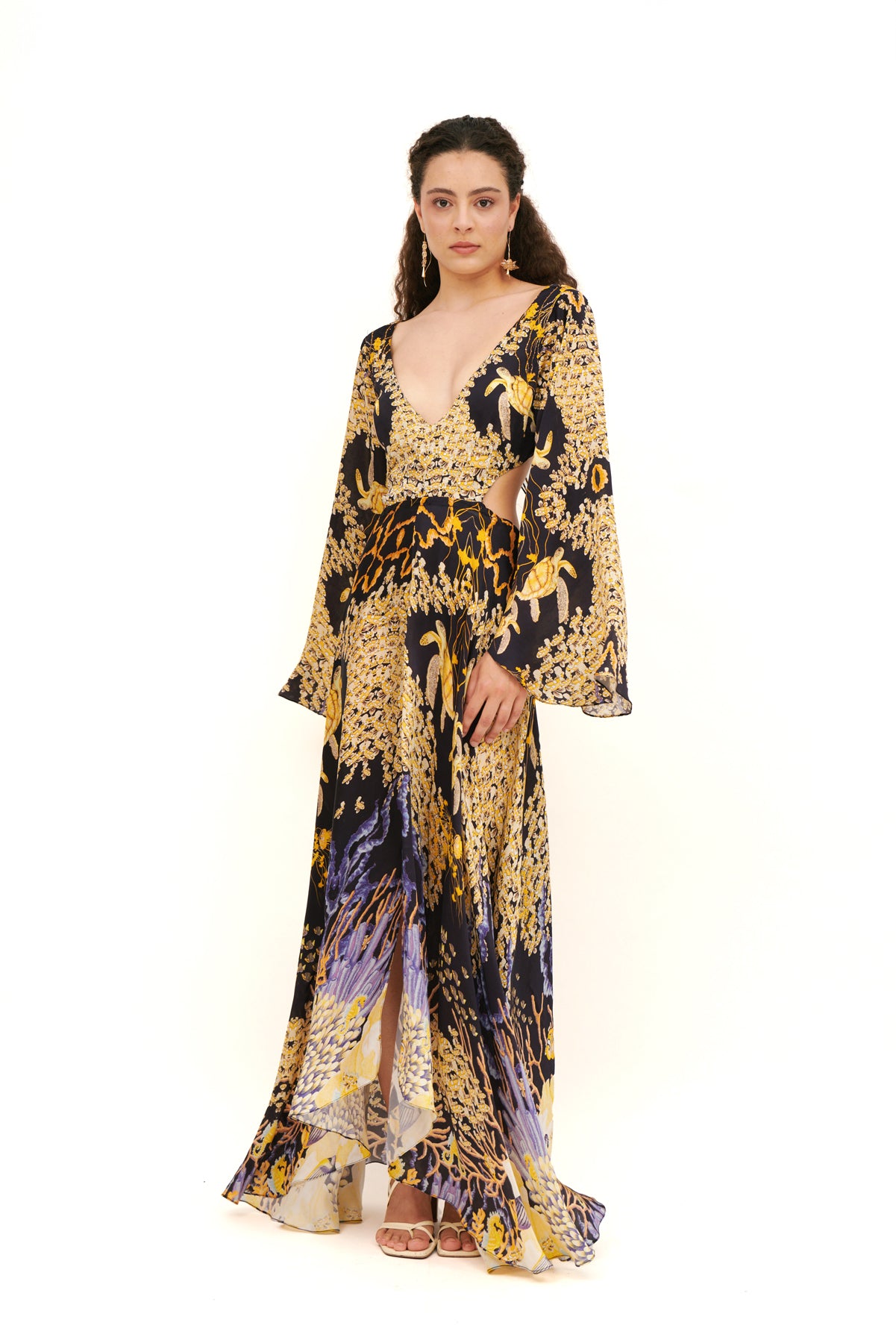 Cut-out long sleeves dress with a modern design and flattering fit for a bold, chic look.