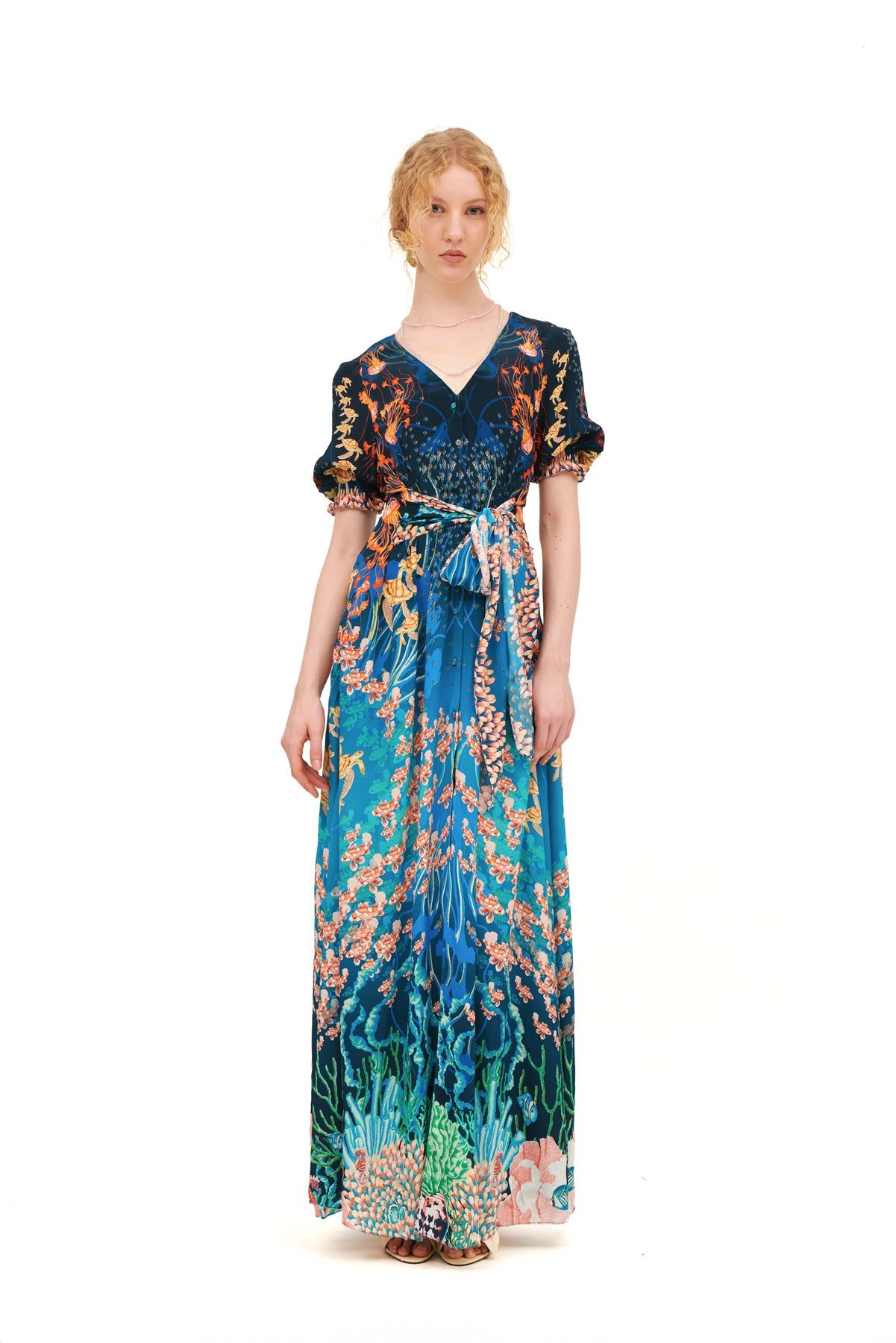 Long dress with draped bow detail on the bodice.
