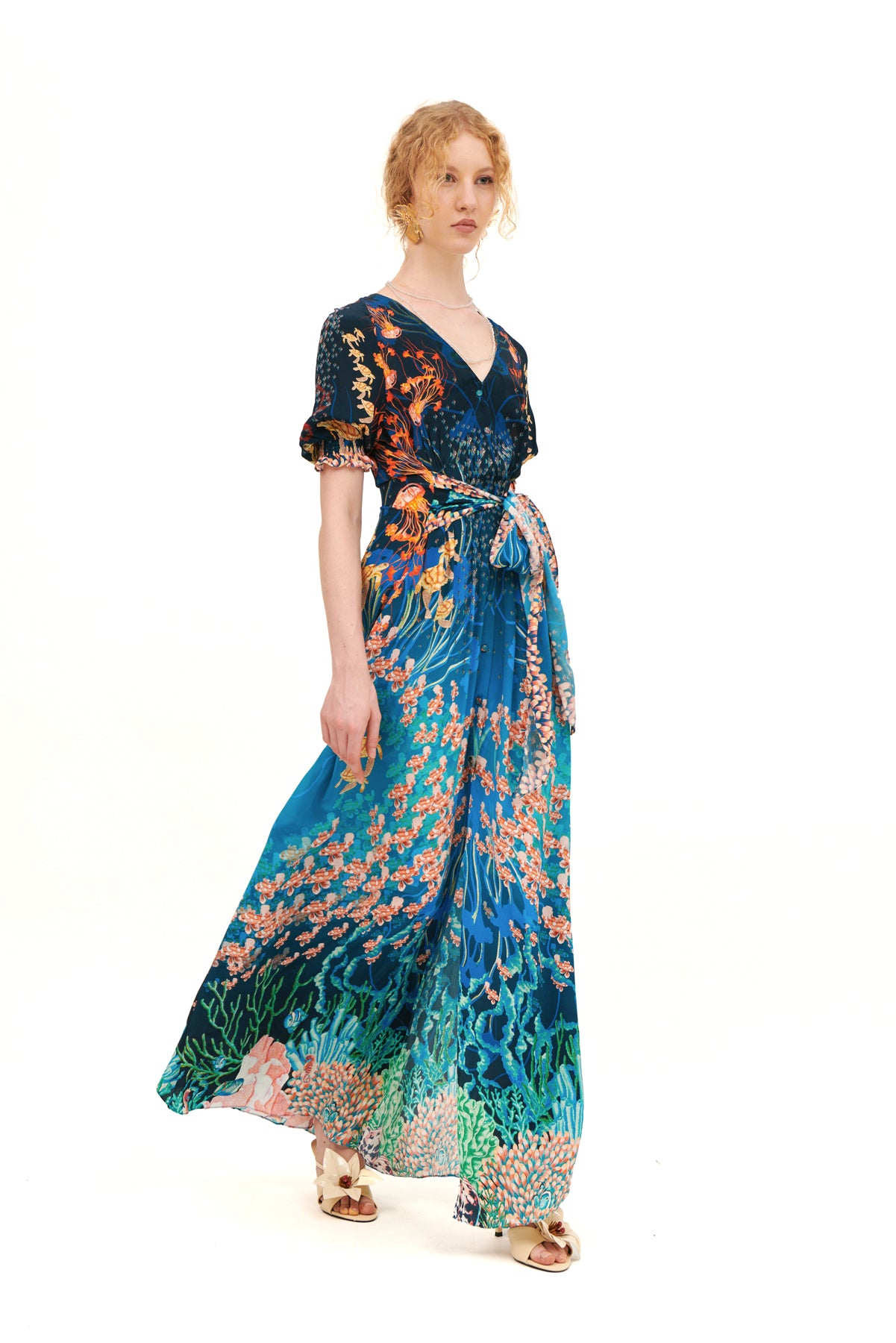 Long dress with draped bow detail on the bodice.