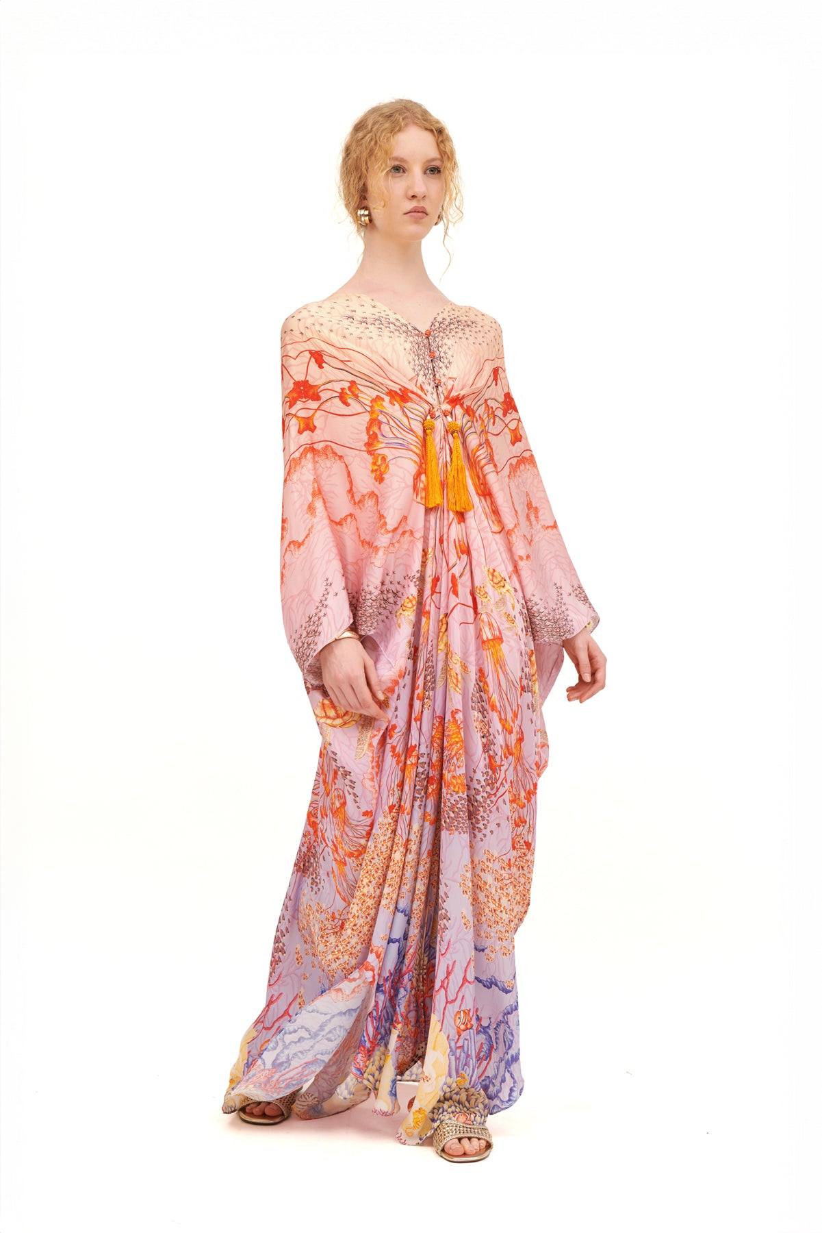 Stella gathered cover-up with a flowing silhouette and gathered details, perfect for beachside lounging or casual outings.