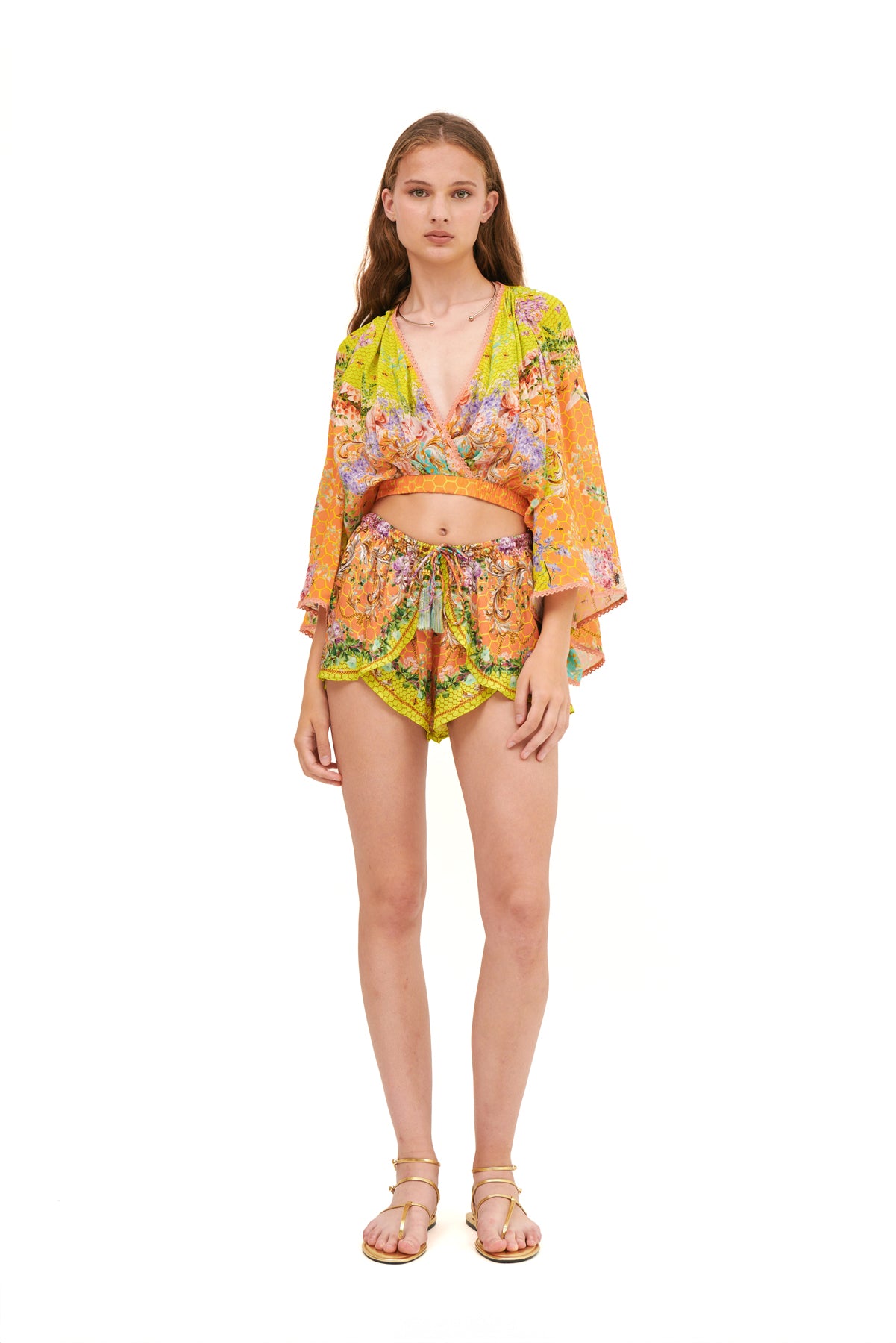 Draped top with an elastic belt, featuring a flattering fit and elegant design for a chic, comfortable look.