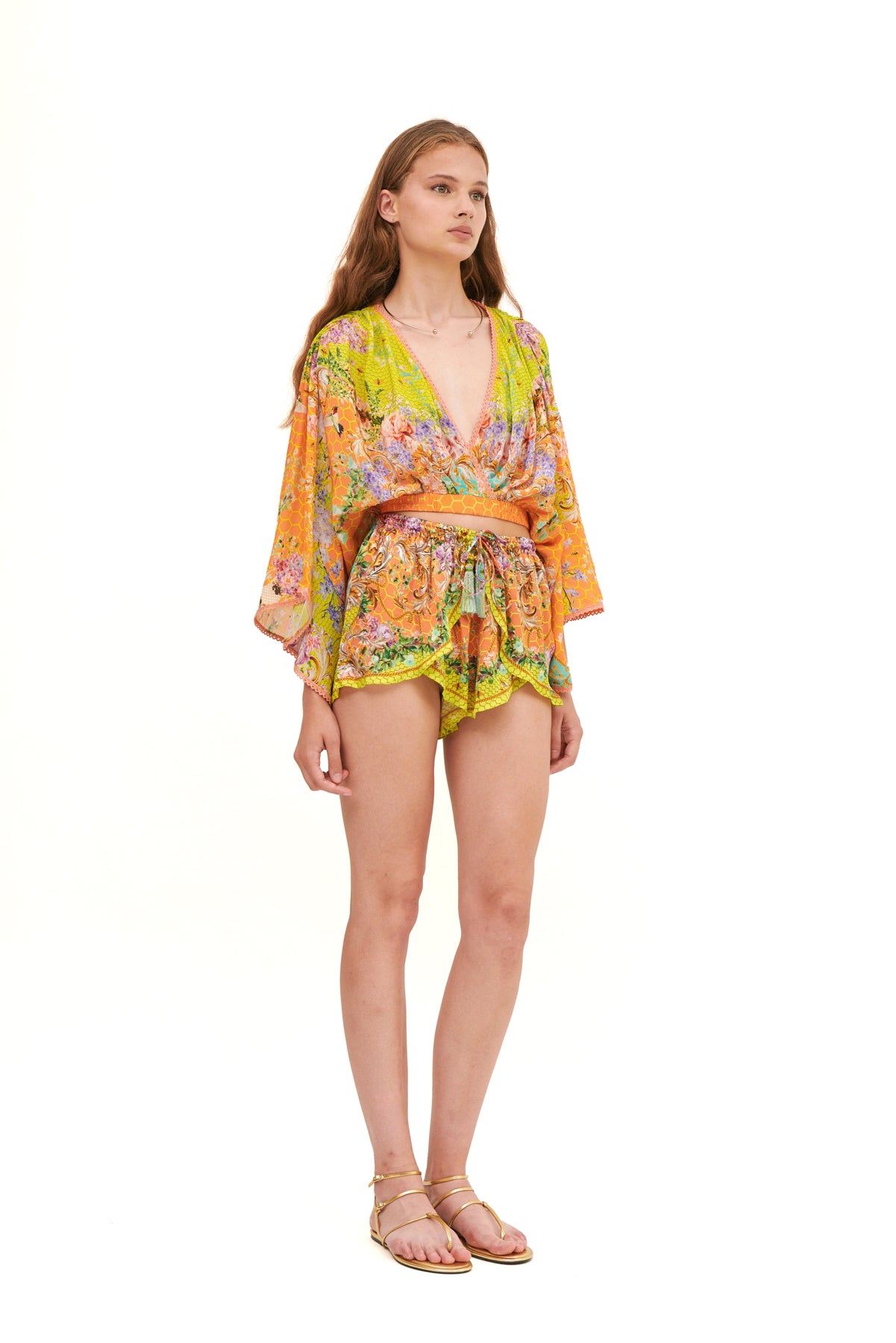 Draped top with an elastic belt, featuring a flattering fit and elegant design for a chic, comfortable look.