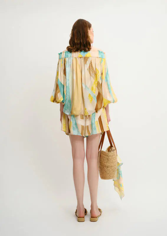 Back view of Sahara Giorno Pleated Aura Shorts by Koré Collections