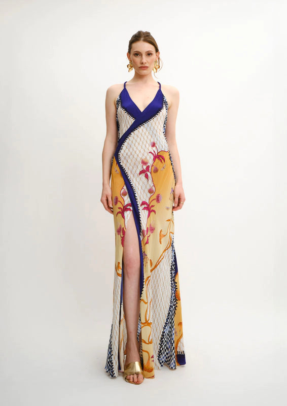 Model wearing Koré Collections Blooming Night Siren Backless Maxi Dress in cherry satin, front view.