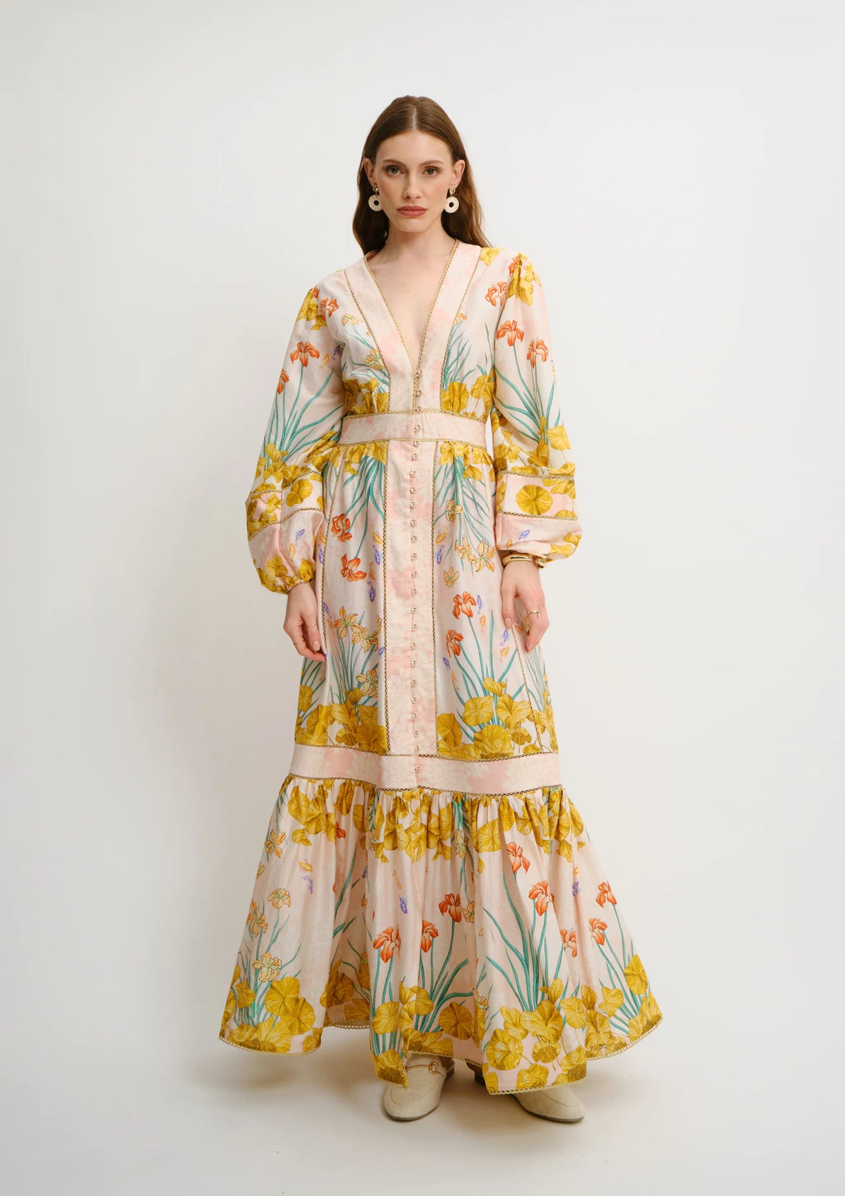Model wearing Koré Collections Poesia Maxi Chemisier in the Jardin au Soleil print, front view.