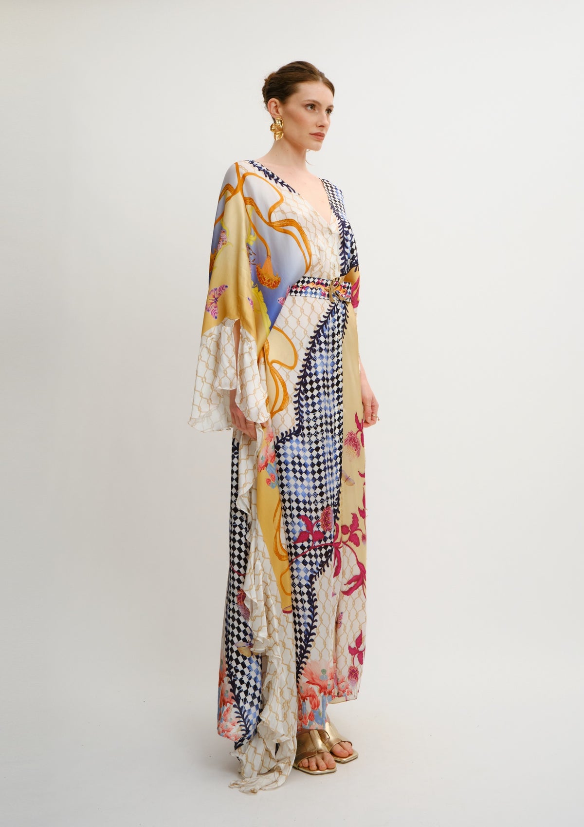 Model wearing Koré Collections Ruffled Fullness Kaftan in the Blooming Night print.