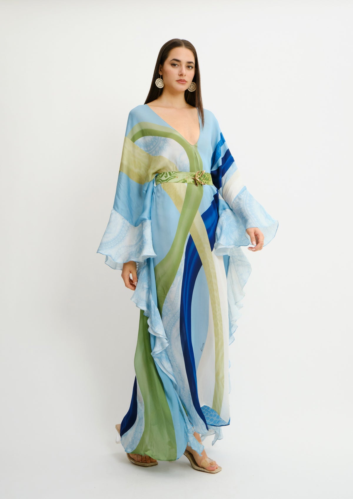 Model wearing Koré Collections Ruffled Fullness Kaftan in the Sahara Sera print, side view.