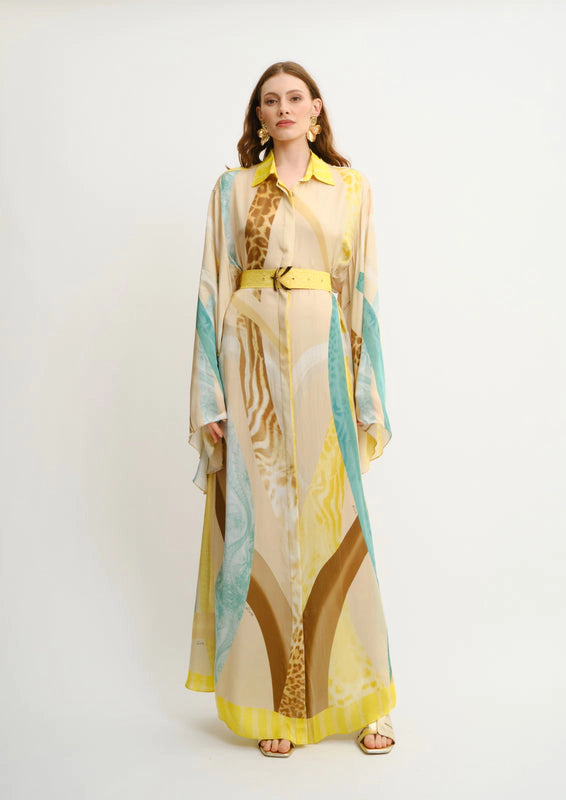 Model wearing Sahara Giorno Rosa maxi shirt dress by Koré Collections with kimono sleeves and a matching printed belt.