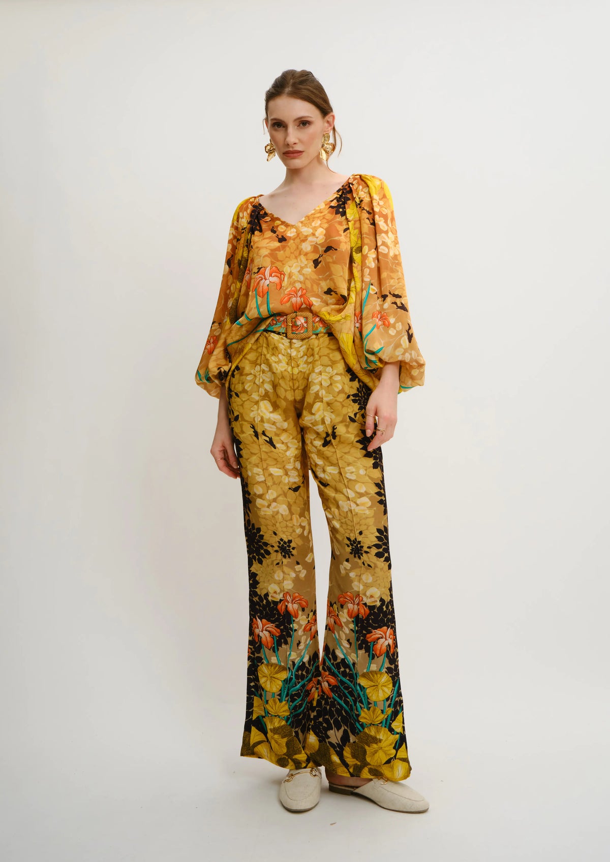 Model wearing Straight-fit summer trousers in Jardin de Lune print by Koré Collections