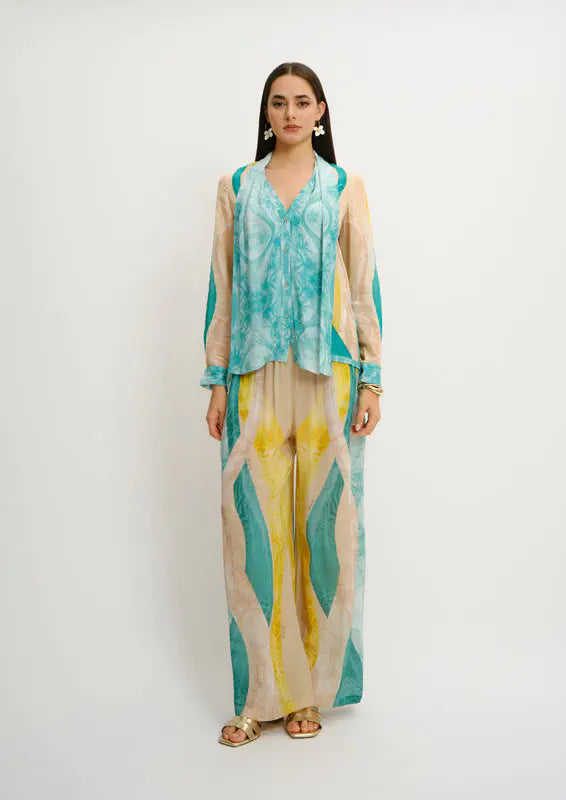 Model wearing wide-fit summer trousers in Sahara Giorno print by Koré Collections