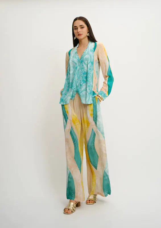Model wearing Koré Collections Sahara Giorno printed trousers styled for summer resortwear