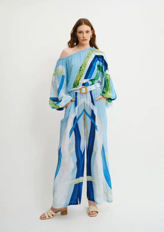 Model wearing Wide-fit summer trousers in Sahara Sera print by Koré Collections